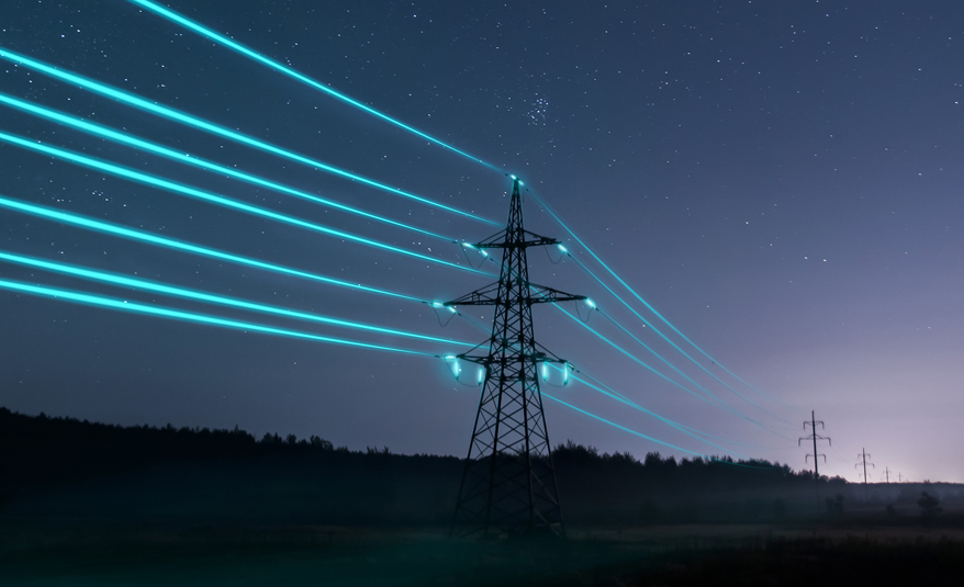 Nighttime view of power lines illuminated with blue energy streams, symbolizing electricity transmission and modern energy systems, set against a starry sky and a silhouette of distant hills.